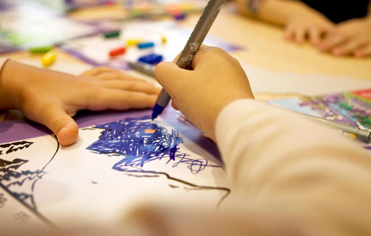 Photo of a childs hand drawing